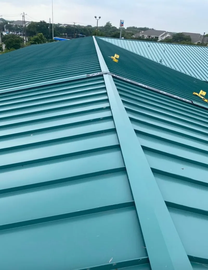Green commercial metal roof ridge and valley for Metal Roof Repair in Devils Lake